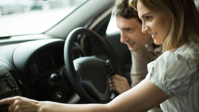 Couple exploring a rental car